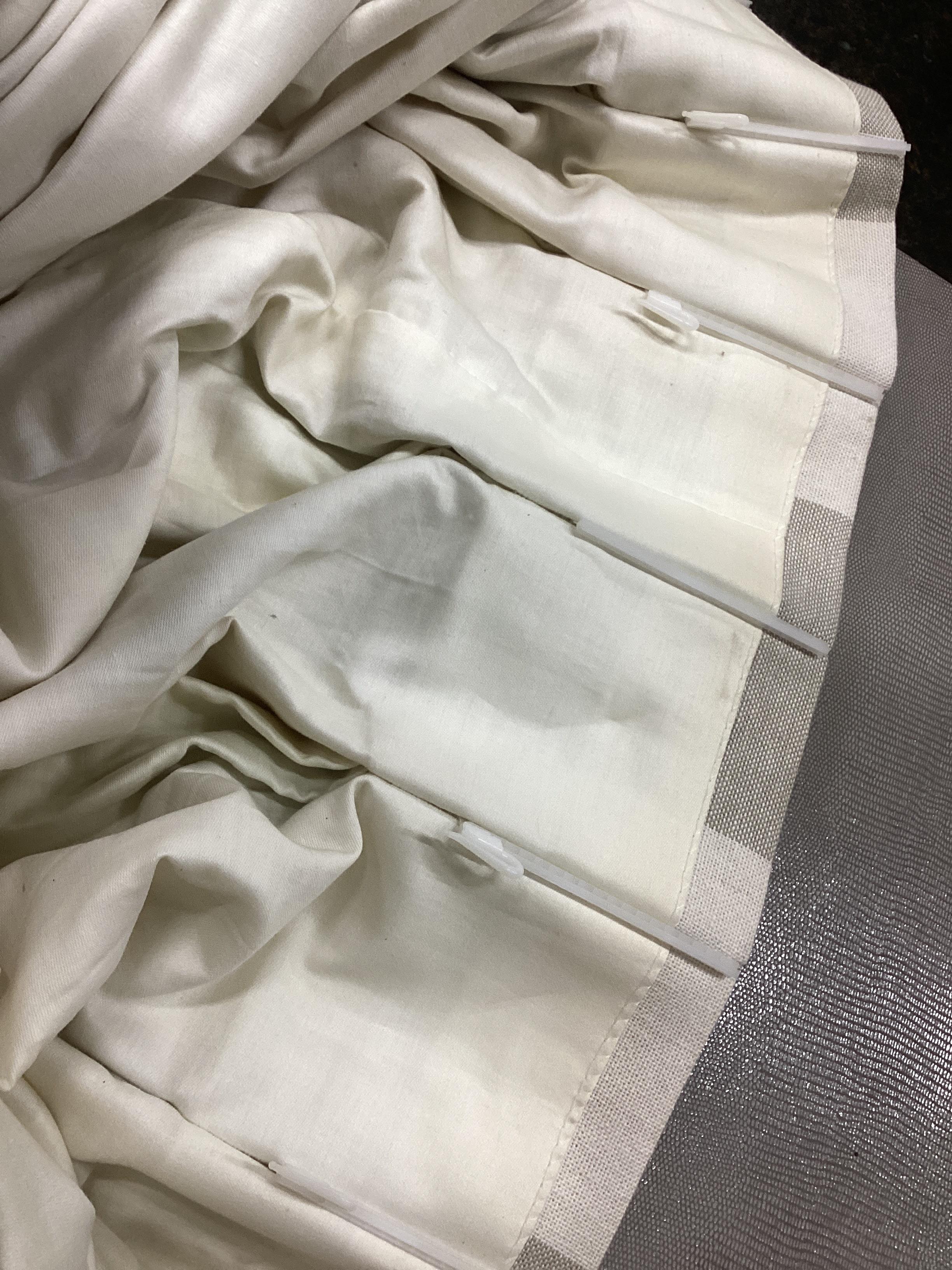 Three pairs of French grey and natural linen curtains, one pair 120cm / 440cm width, drop 224cm, two pairs 120cm / 320cm width, drop 210cm. (All measurements approximate).
